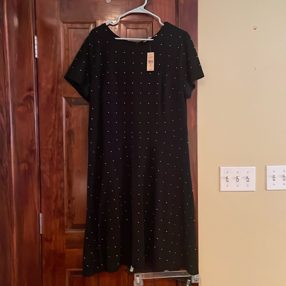 The loft. Beautiful black dress with gold beads. Never worn
